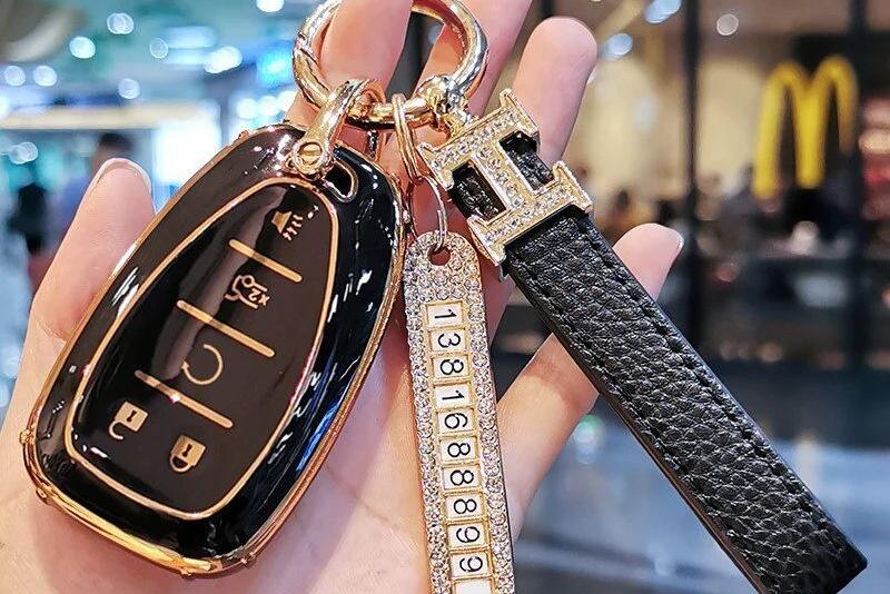 Aesthetic keys and key chain with Louis Vuitton key pouch, puff ball, and  jeweled initia…