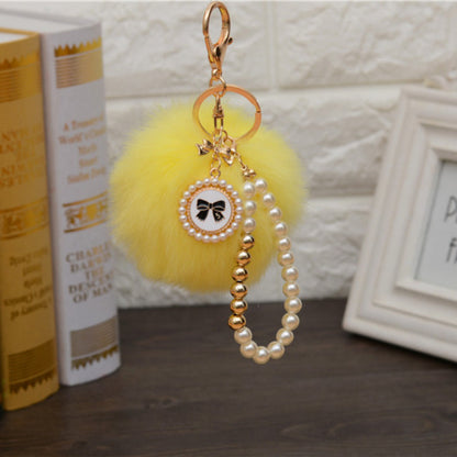 Carsine Fluff Ball Bow Pearl Chain Keychain Yellow