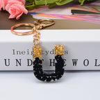 Carsine Black Pompom 26 Alphabets Keychain gold / U